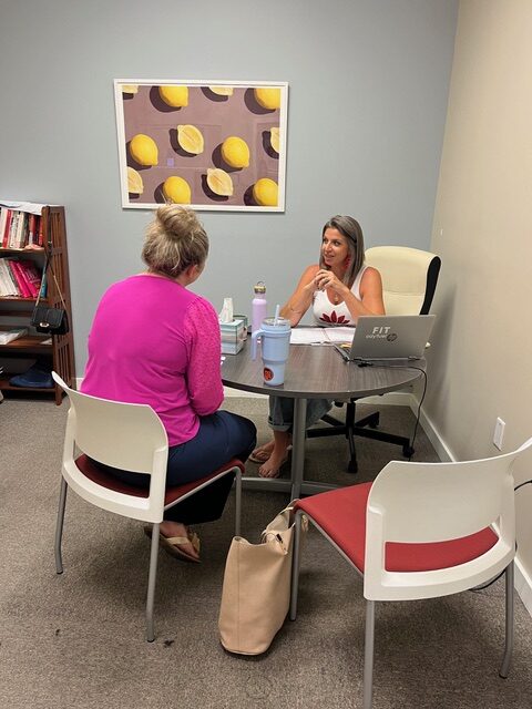 Health coach meeting with a client at Impact Weight Management in Gainesville, FL